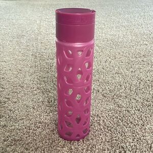 Lululemon pink glass water bottle.
